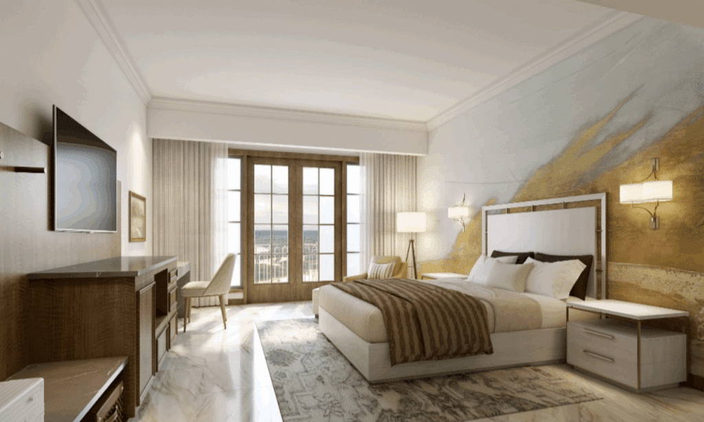 Cozy hotel suite with queen bed, neutral colors and low lighting